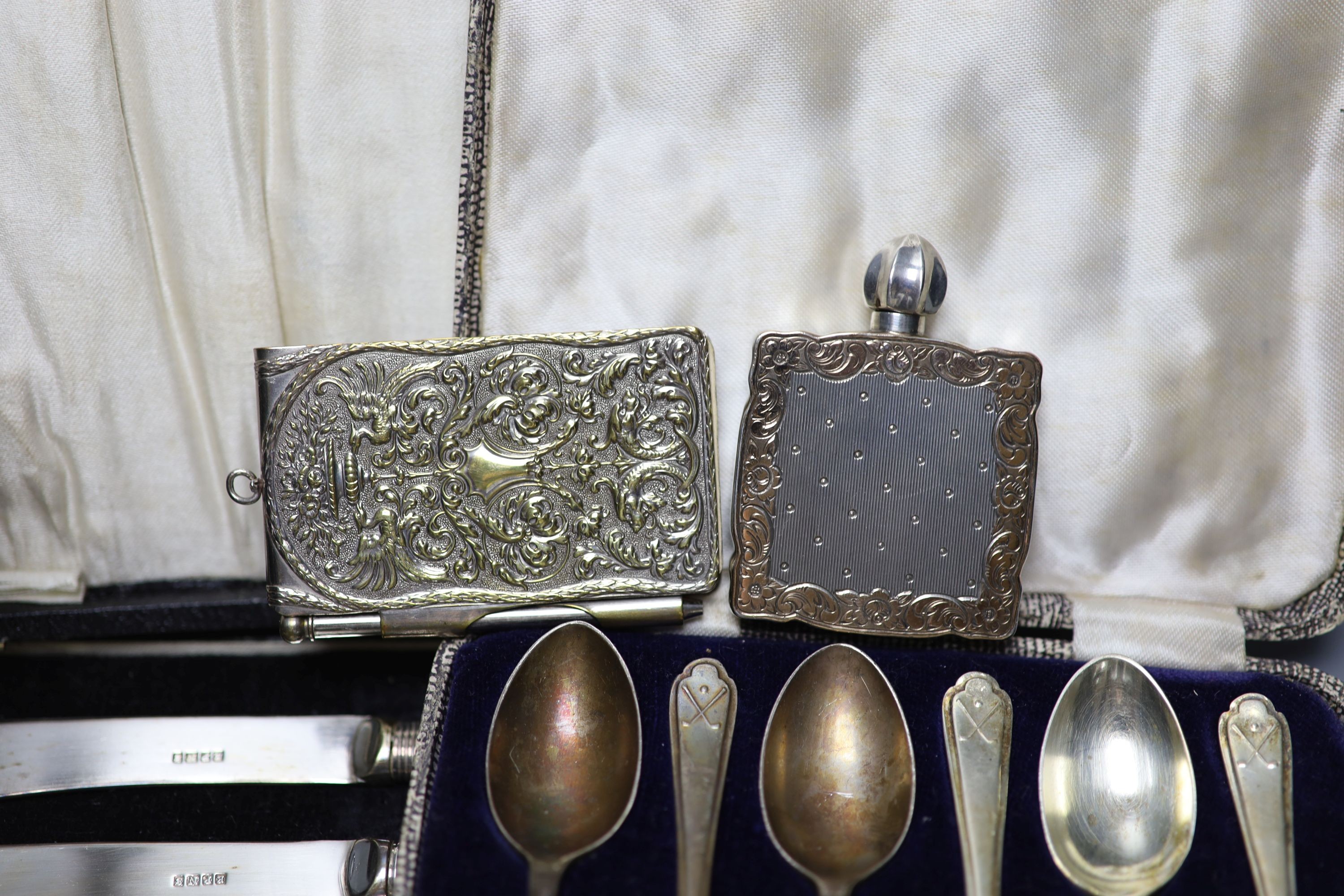 Mixed small silver and plated wares including sterling cup, repousse silver boxes, cased silver teaspoons, silver card case, 925 whistle, plated Art Nouveau aide memoire, plated salver etc.